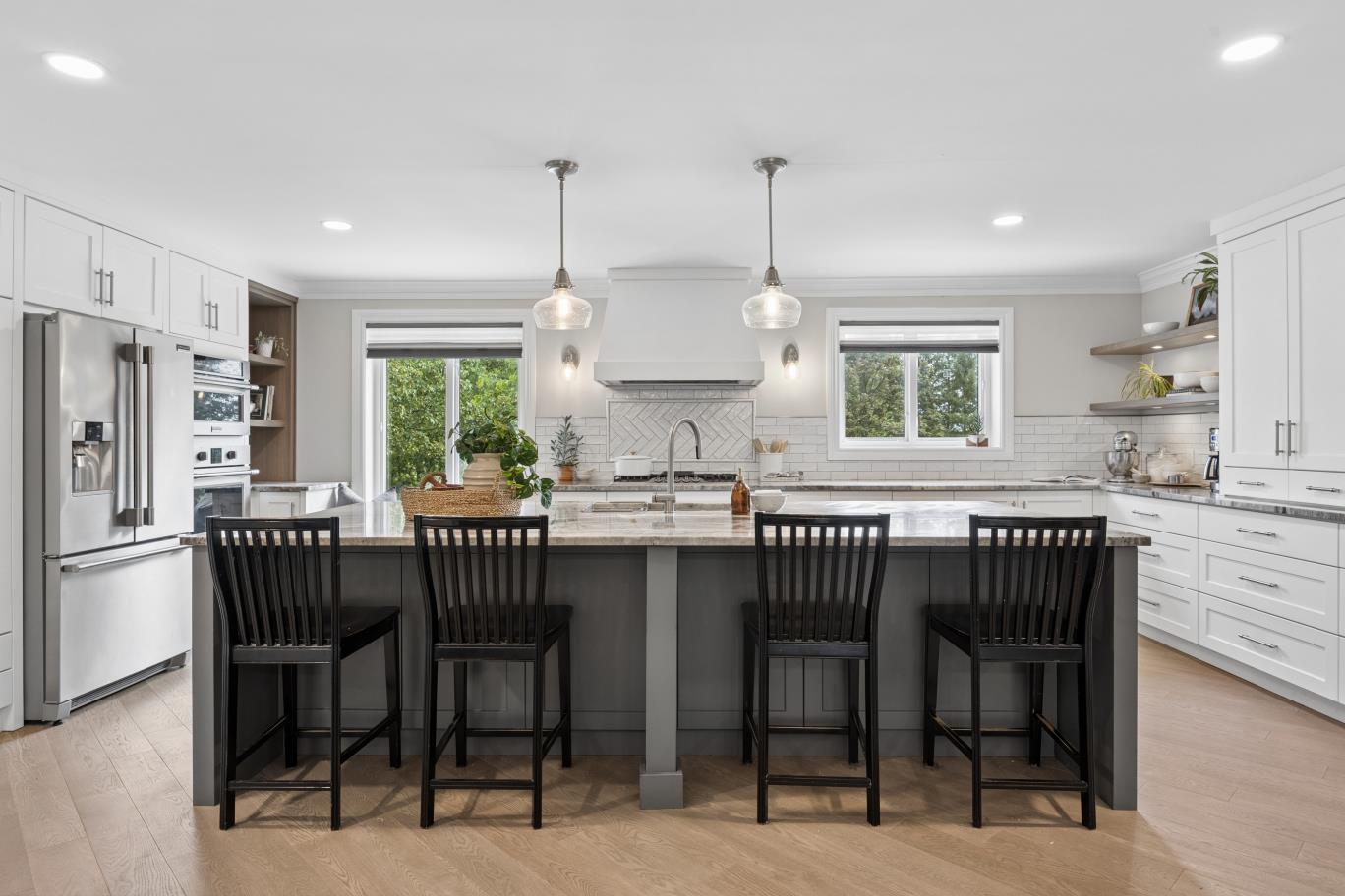 2021 open-concept gourmet kitchen with quartzite island at 30 Potters Lane, Clarington