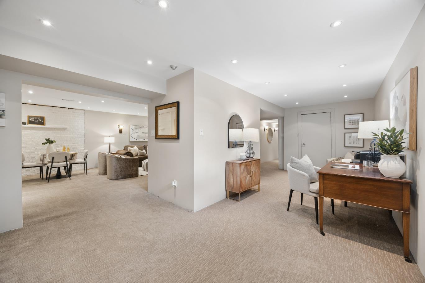 Open-concept finished basement living and office areas at 30 Potters Lane